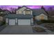 Charming two-story home with a well-kept lawn, three-car garage and tasteful landscaping at 4530 Ridgewood Ct, Castle Rock, CO 80109