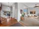 Inviting foyer with hardwood floors, staircase, and a view into the living room with comfortable seating at 4530 Ridgewood Ct, Castle Rock, CO 80109