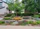 Front yard featuring a lush garden, colorful plants, and a well-manicured lawn, adding curb appeal at 4530 Ridgewood Ct, Castle Rock, CO 80109