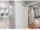 Hallway leading to a laundry room with white washer, dryer, and cabinetry at 4530 Ridgewood Ct, Castle Rock, CO 80109