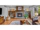 Comfortable living room with a wood-burning fireplace and built-in bookshelves at 4530 Ridgewood Ct, Castle Rock, CO 80109
