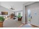 Bright living room with a vaulted ceiling, fan, neutral carpet, and large window letting in natural light at 4530 Ridgewood Ct, Castle Rock, CO 80109