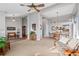 Spacious living room with neutral carpet flowing into a dining area with abundant natural light and views at 4530 Ridgewood Ct, Castle Rock, CO 80109