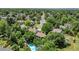 Aerial view of a neighborhood with tree-lined streets and well-maintained homes at 8130 E Bethany Pl, Denver, CO 80231