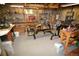This unfinished basement is being used as a gym and workspace at 8130 E Bethany Pl, Denver, CO 80231