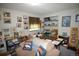 This bedroom features a lounger, shelving and pictures on the wall at 8130 E Bethany Pl, Denver, CO 80231