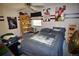 This bedroom features horizontal striped walls, a queen bed and ceiling fan at 8130 E Bethany Pl, Denver, CO 80231