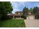 Attractive two-story house featuring a covered porch and well-maintained lawn at 8130 E Bethany Pl, Denver, CO 80231