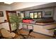 This room features a large hot tub with access to the outside and a leafy plant at 8130 E Bethany Pl, Denver, CO 80231