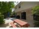 A private backyard patio features outdoor dining and cooking spaces at 8130 E Bethany Pl, Denver, CO 80231
