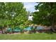 Refreshing backyard pool with a slide and ladder, enclosed by a wooden fence at 8130 E Bethany Pl, Denver, CO 80231