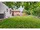 Large backyard features a well-maintained lawn and covered patio area at 13225 Peacock Dr, Lone Tree, CO 80124