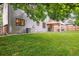 Spacious backyard offers a large lawn, covered patio, and privacy fencing at 13225 Peacock Dr, Lone Tree, CO 80124