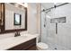 Modern bathroom featuring sleek fixtures, a glass-enclosed shower, and bright lighting at 13225 Peacock Dr, Lone Tree, CO 80124