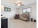 Well-lit bedroom with a crib, a ceiling fan, and large windows at 13225 Peacock Dr, Lone Tree, CO 80124