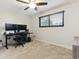 Bedroom with neutral carpet, ceiling fan, and dual-monitor gaming setup at 13225 Peacock Dr, Lone Tree, CO 80124