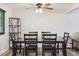 Cozy dining room featuring a dark wood table with seating for six and an open concept floorplan at 13225 Peacock Dr, Lone Tree, CO 80124