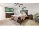 Comfortable main bedroom with a ceiling fan, carpet, and ample closet space at 13225 Peacock Dr, Lone Tree, CO 80124