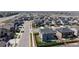 Aerial view of suburban neighborhood featuring tidy lawns, sidewalks, and uniform homes on a sunny day at 12828 Fox Ct, Westminster, CO 80234