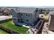 Aerial view of the home's backyard, patio, landscaping, and fence on a sunny day at 12828 Fox Ct, Westminster, CO 80234