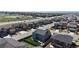 View of suburban neighborhood features uniform homes, a four-lane road, and a sports field at 12828 Fox Ct, Westminster, CO 80234