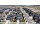 A high-angle aerial view of a well-planned suburban neighborhood with uniform homes, green lawns, and sidewalks at 12828 Fox Ct, Westminster, CO 80234