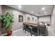 Basement area featuring a live plant, movie posters, counter with stools, and sectional couch at 12828 Fox Ct, Westminster, CO 80234
