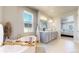 Bright bathroom with a soaking tub, double vanity sinks, and plenty of light at 12828 Fox Ct, Westminster, CO 80234