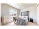 Bright bedroom featuring a rustic wood bed frame with a window and bedside tables at 12828 Fox Ct, Westminster, CO 80234