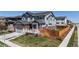 Well-kept two-story home with manicured lawn and fenced backyard, perfect for outdoor enjoyment at 12828 Fox Ct, Westminster, CO 80234
