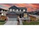 Charming two-story home with a brick and siding exterior, complemented by a well-maintained front yard at 12828 Fox Ct, Westminster, CO 80234