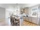 Spacious kitchen with a large island, pendant lighting, and stainless steel appliances at 12828 Fox Ct, Westminster, CO 80234