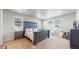 Serene main bedroom featuring a large bed, neutral tones, and plenty of natural light at 12828 Fox Ct, Westminster, CO 80234