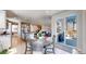 Bright, airy kitchen and breakfast nook with an open concept layout to the outdoor patio at 12828 Fox Ct, Westminster, CO 80234