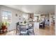Inviting open floor plan connecting the kitchen, dining, and living areas for seamless entertaining at 12828 Fox Ct, Westminster, CO 80234