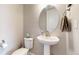 Neat powder room with a pedestal sink, and neutral decor at 12828 Fox Ct, Westminster, CO 80234