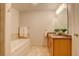 Bathroom with a large soaking tub and double vanity at 2200 S University Blvd # 201, Denver, CO 80210