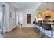 Living room with hardwood floors and access to bedroom at 2200 S University Blvd # 201, Denver, CO 80210