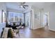 Living room with hardwood floors and access to balcony at 2200 S University Blvd # 201, Denver, CO 80210
