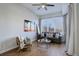 Bright living room with large window, hardwood floors, and comfy seating at 2200 S University Blvd # 201, Denver, CO 80210