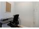 Small home office with a desk, chair, and built-in shelving at 2200 S University Blvd # 201, Denver, CO 80210