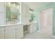 Stylish bathroom with dual sinks, white cabinets, and framed mirrors with sconce lighting at 2105 Keota Ln, Superior, CO 80027