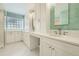 Bright bathroom featuring dual sinks with brushed nickel fixtures and abundant storage in white cabinetry at 2105 Keota Ln, Superior, CO 80027