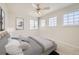 Bright bedroom featuring neutral walls, ample natural light, and a modern ceiling fan at 2105 Keota Ln, Superior, CO 80027