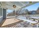 Back deck features a wooden pergola, with views of the backyard in a snow-covered landscape at 2105 Keota Ln, Superior, CO 80027
