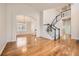 Foyer with hardwood floors, staircase, and an archway leading to the dining room at 2105 Keota Ln, Superior, CO 80027