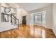 Foyer with staircase, bay windows, hardwood floors, and an arched ceiling at 2105 Keota Ln, Superior, CO 80027