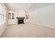Bright living room featuring a fireplace with built-in shelves and a ceiling fan at 2105 Keota Ln, Superior, CO 80027