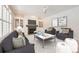 Cozy living room featuring a fireplace, ceiling fan, and neutral-toned furniture with stylish decor at 2105 Keota Ln, Superior, CO 80027