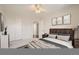Comfortable bedroom featuring carpeted floors, ceiling fan, closet, and decor at 2105 Keota Ln, Superior, CO 80027